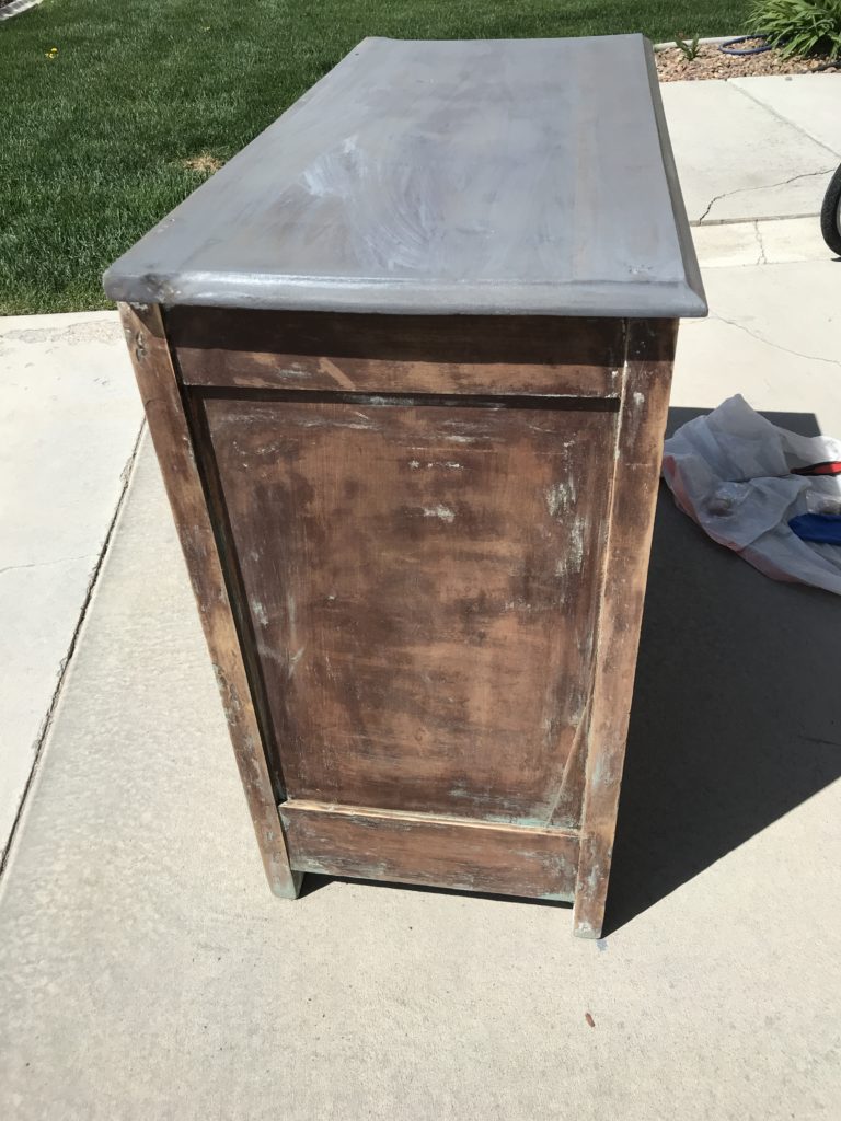 Different angles of dresser top stained in grey