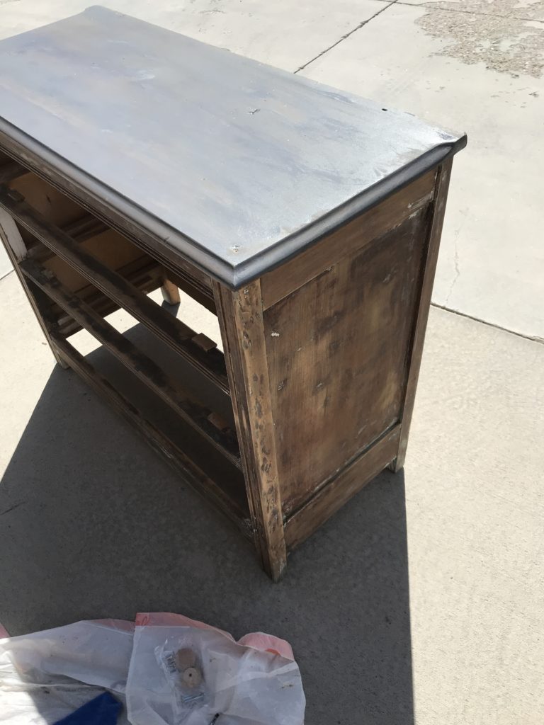 Different angles of dresser top stained in grey