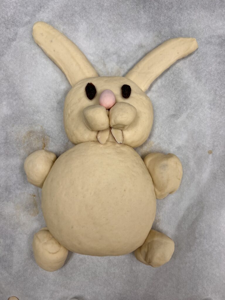 Three photos showing step by step how to shape bunny bread