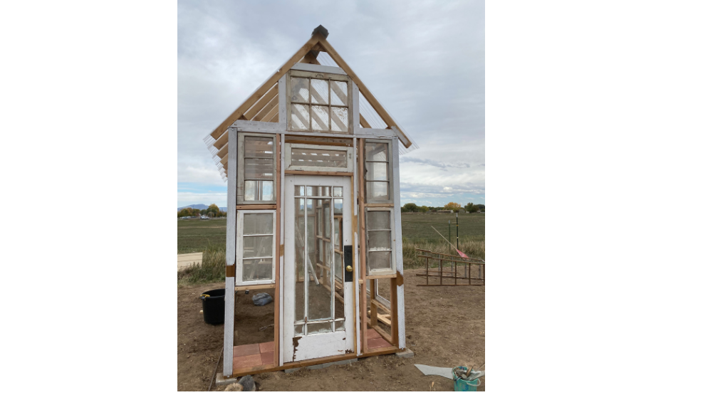 Front of greenhouse with glass door