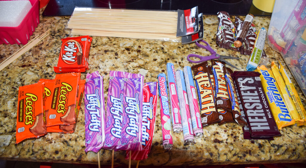 candy bars laid out to compare sizes
