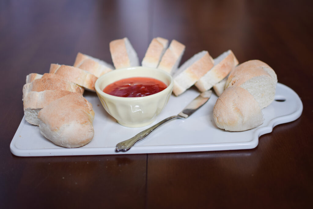 French sourdough bread sliced with strawberry jam.