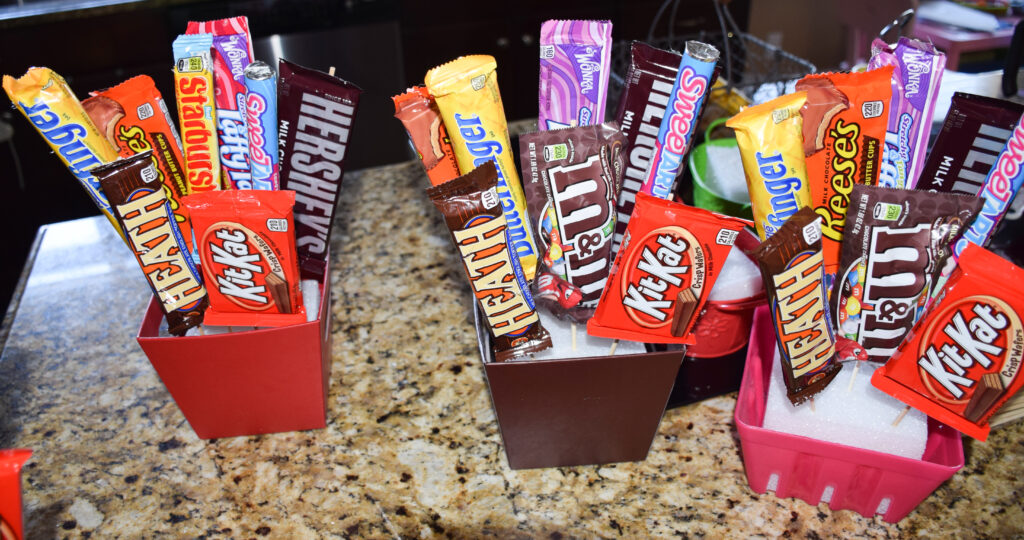 three almost completed candy bouquets