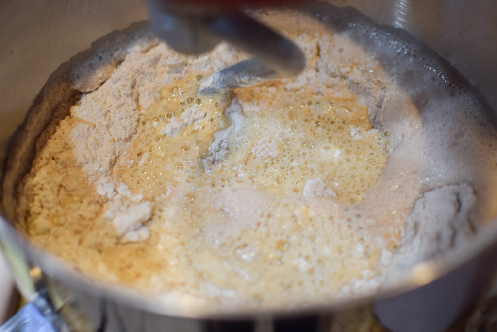 Whole wheat flour added to yeast mixture