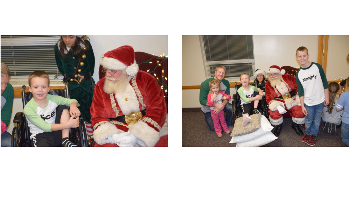 kids and a dad visiting with santa. One boy has a broken leg and is in a wheelchair